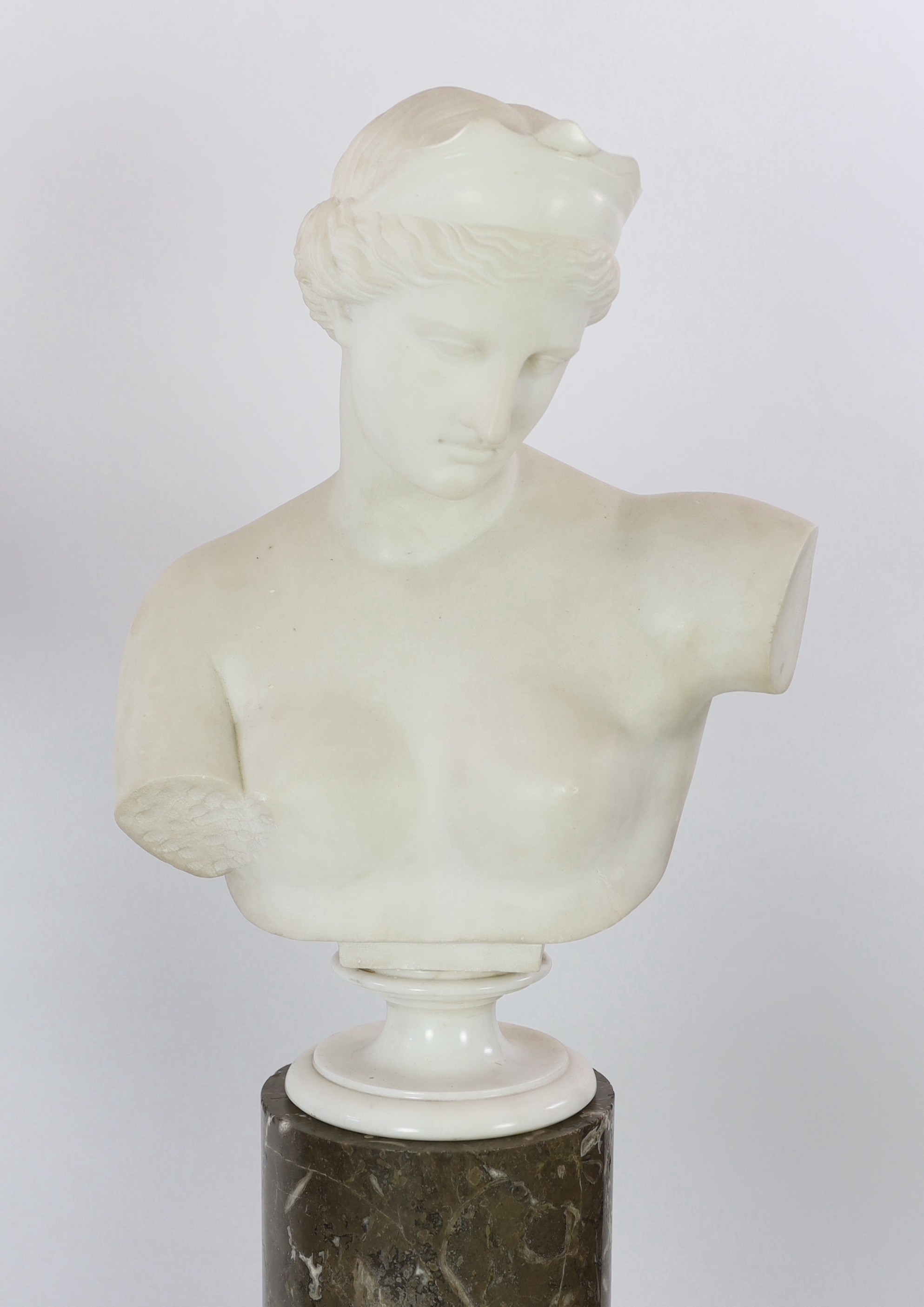 After the Antique. A pair of 19th century white marble busts of Apollo and Diana, Busts 57cm high, columns 121.5cm high